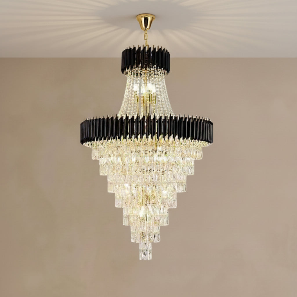 Chandelier with black and gold accents on a beige wall