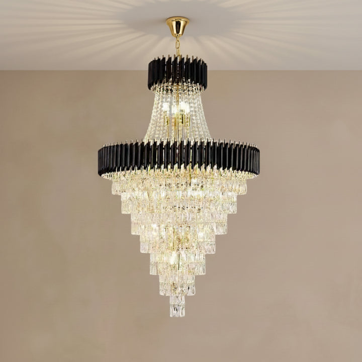 Chandelier with black and gold accents on a beige wall