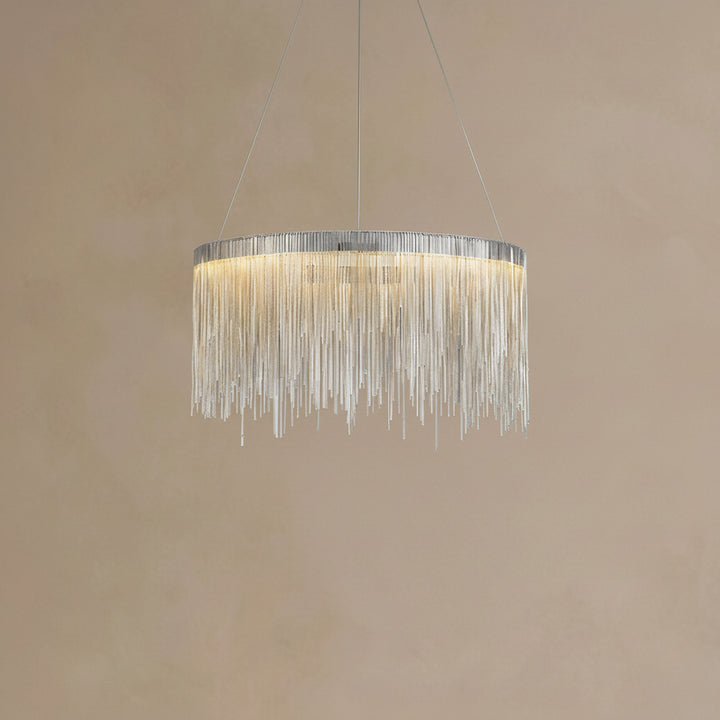 Chandelier with hanging crystals on a beige background