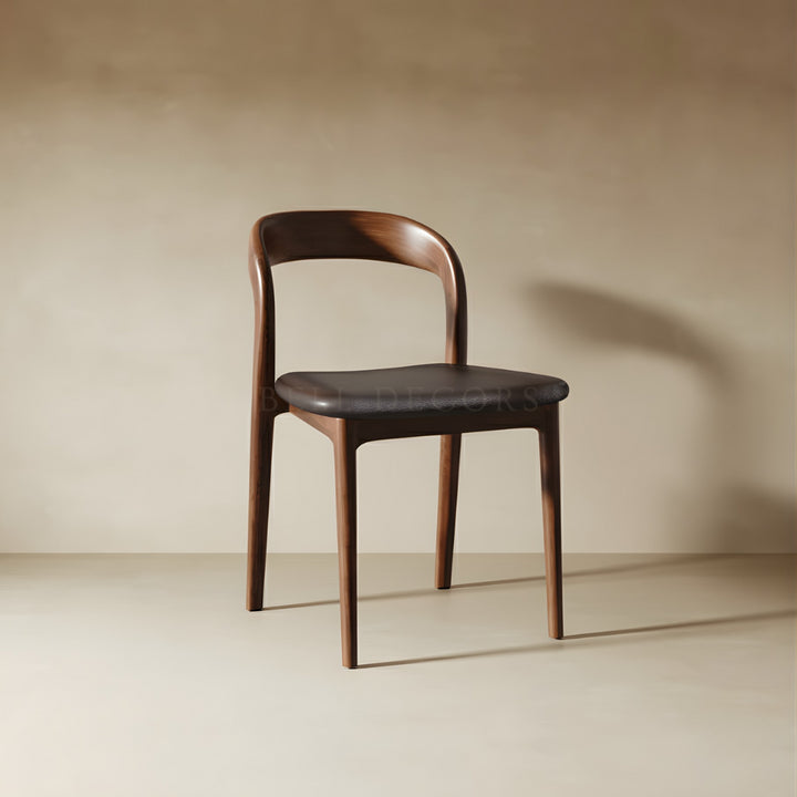 Wooden chair with a black seat on a beige background