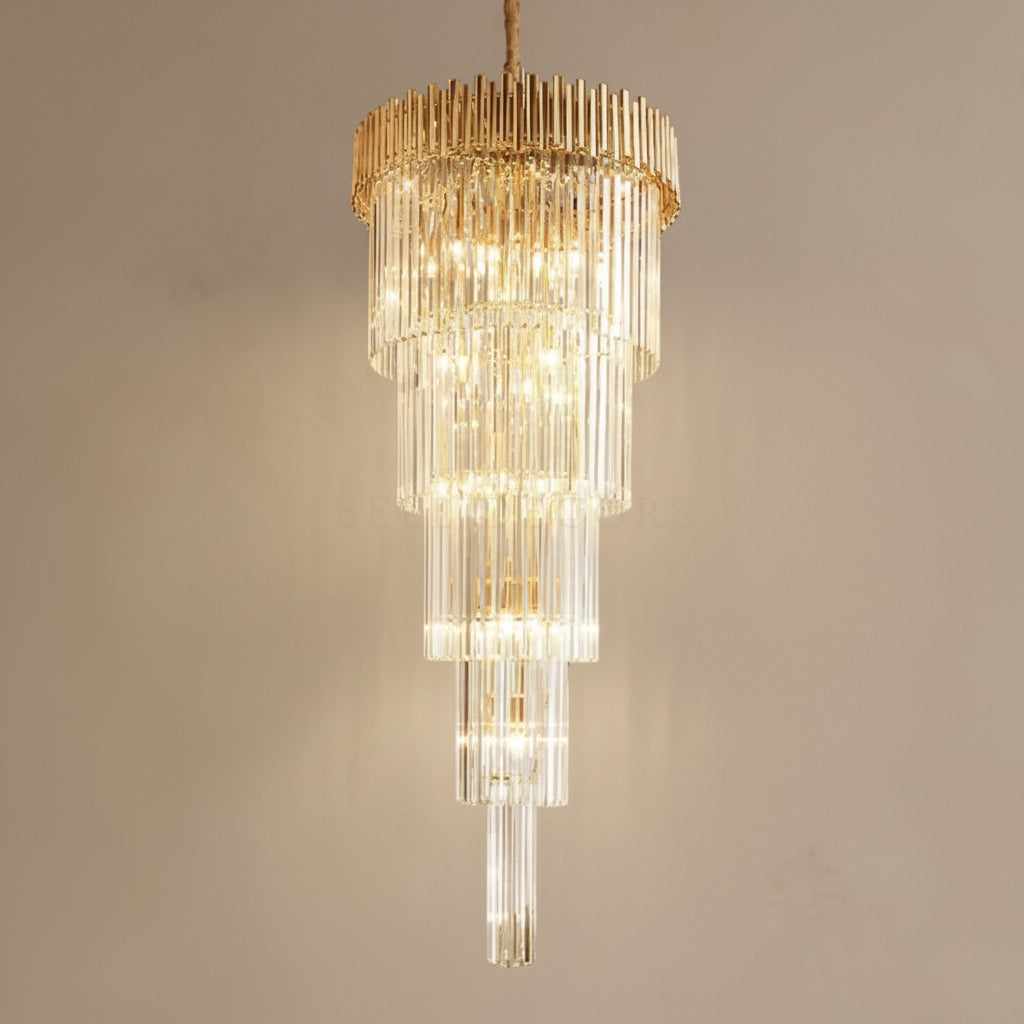Gold and clear chandelier against a beige background