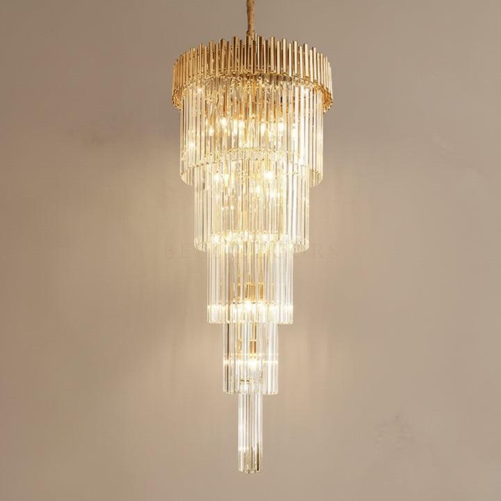 Gold and clear chandelier against a beige background