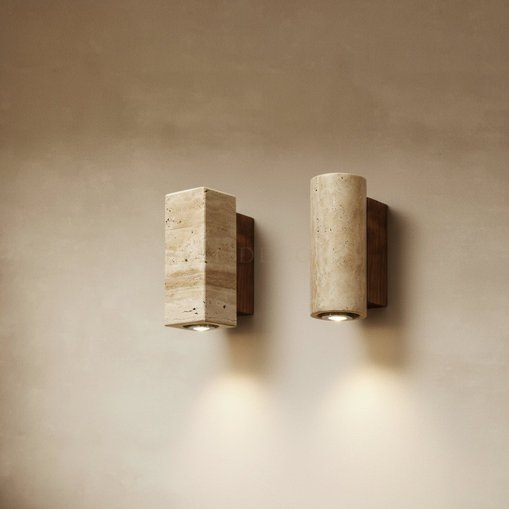 Two concrete wall lights on a beige wall