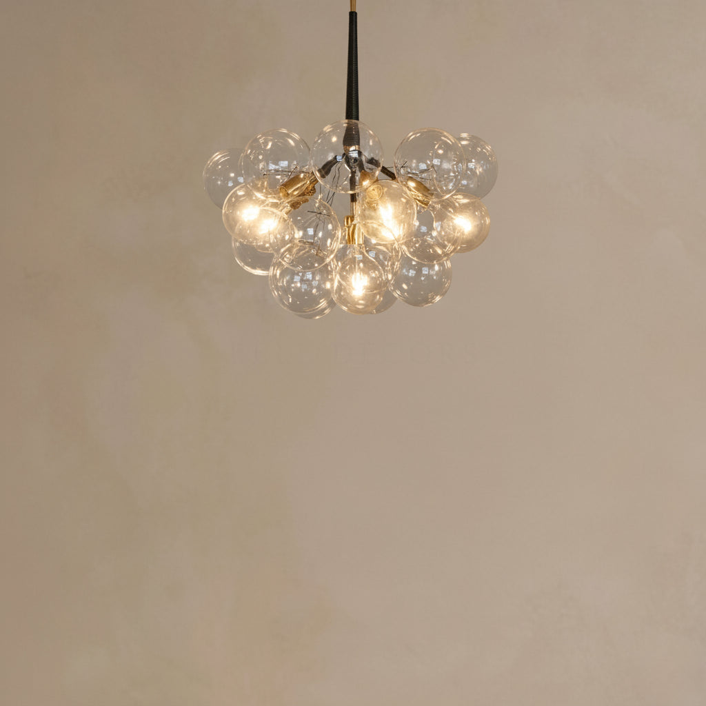 Chandelier with multiple glass bulbs on a plain background