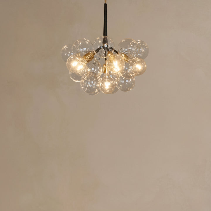 Chandelier with multiple glass bulbs on a plain background