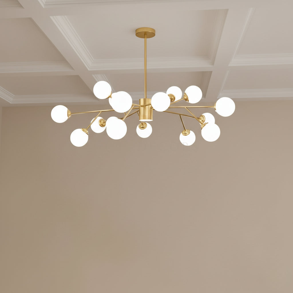 Gold chandelier with multiple light bulbs hanging from a ceiling.