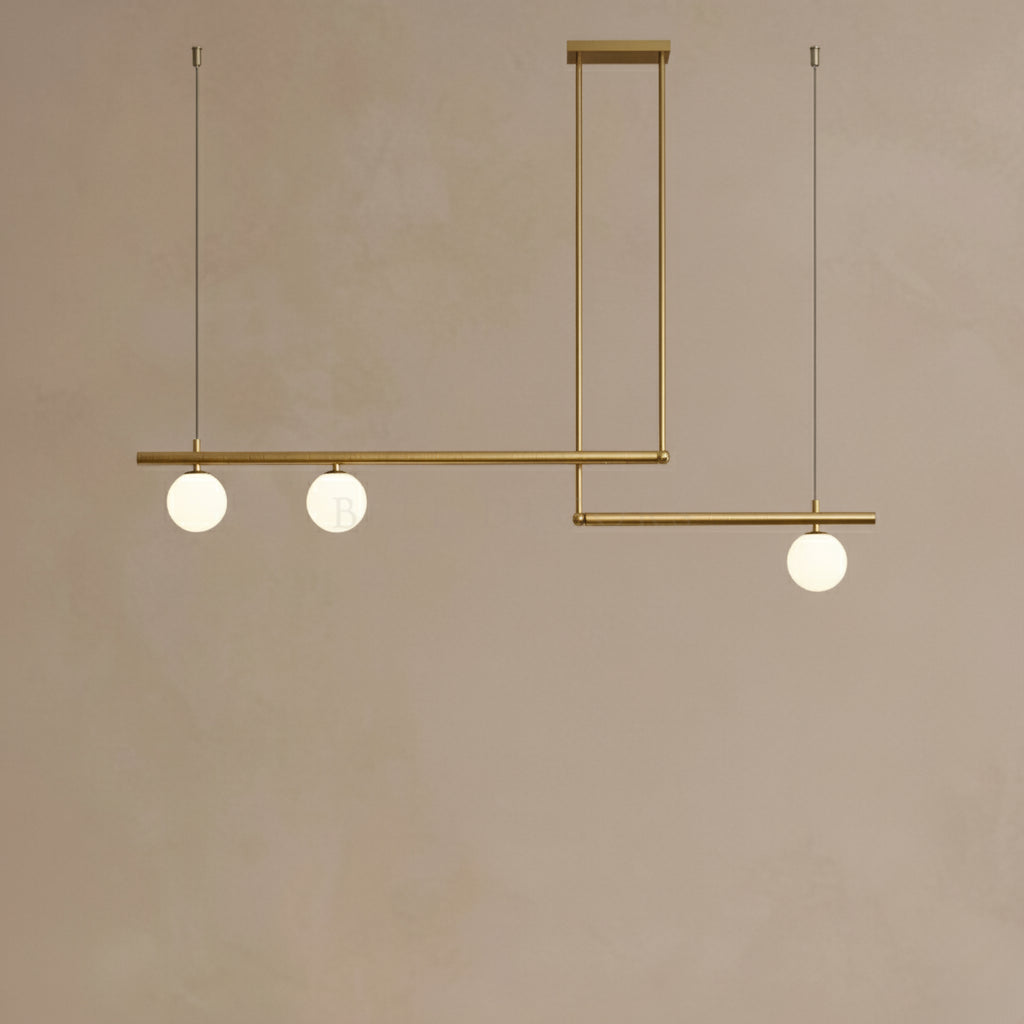 Modern pendant light with three spherical bulbs on a beige background
