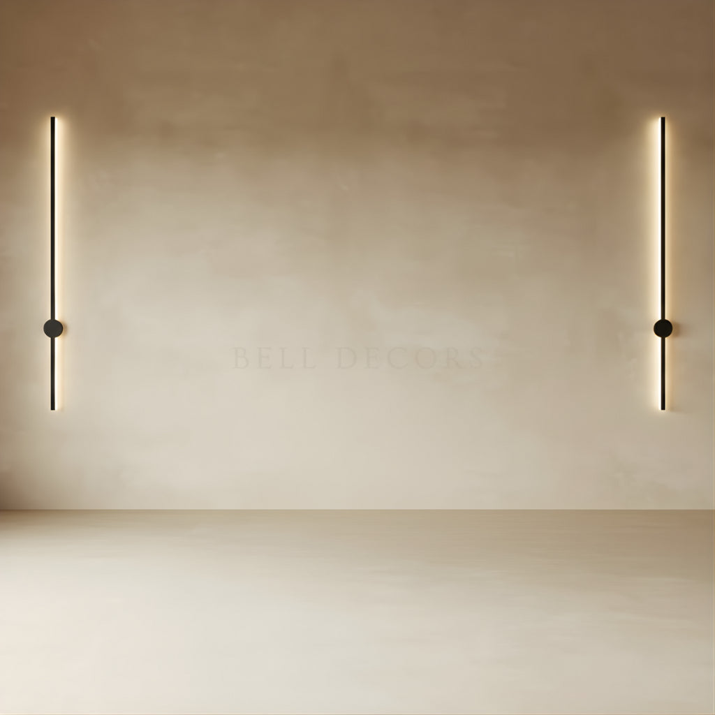 Two modern wall lights on a beige wall
