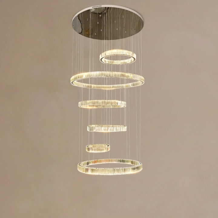 Chandelier with multiple circular rings on a beige background