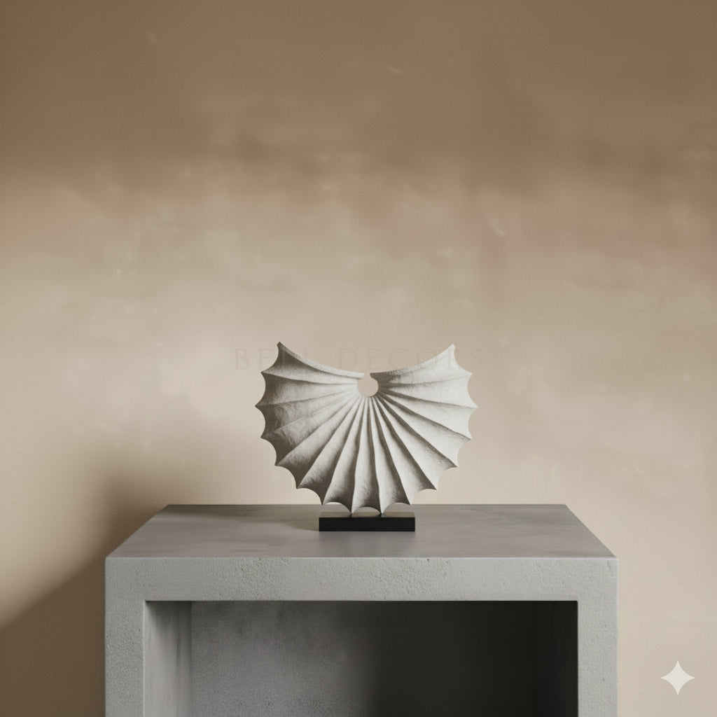 Abstract sculpture on a pedestal against a beige wall