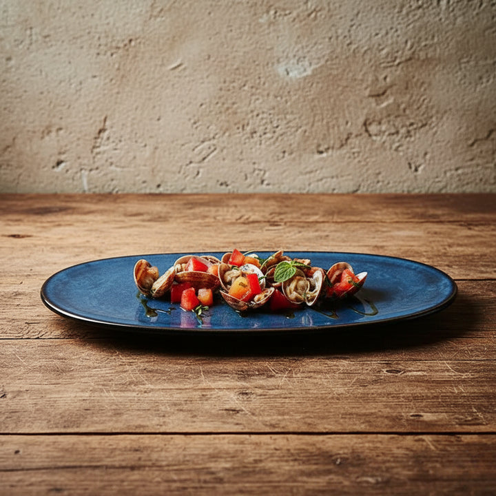 Blue plate with a seafood dish on a wooden table