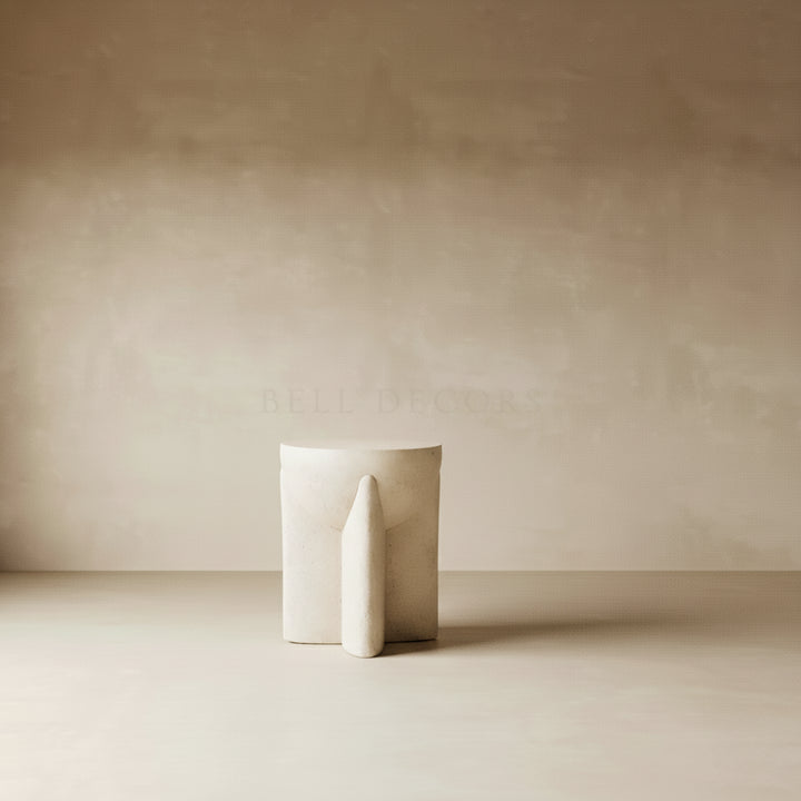 Minimalist white sculpture on a plain beige background