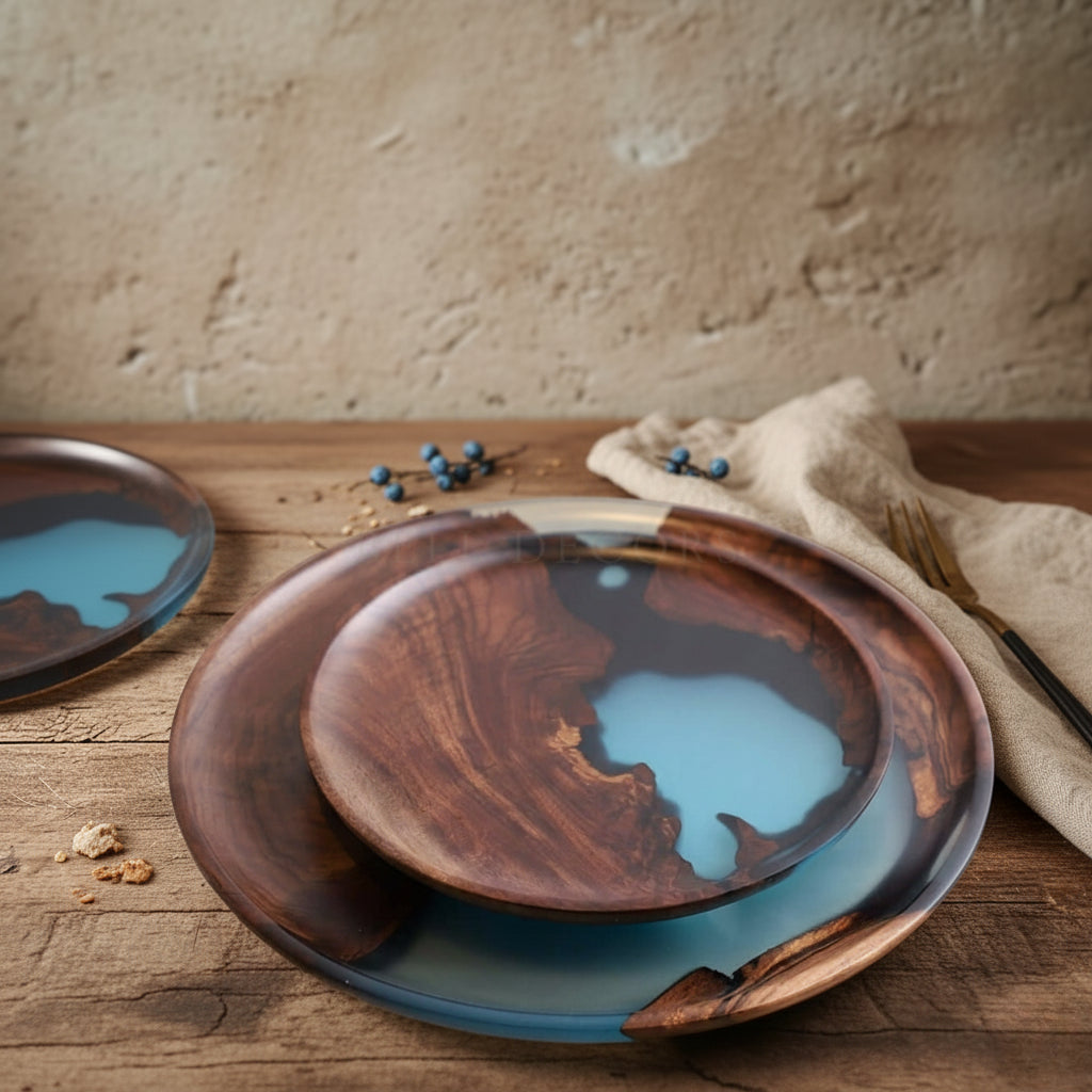 Wooden plates with blue resin inlay on a wooden surface