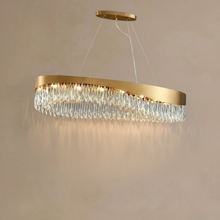 Gold chandelier with crystal accents on a beige background
