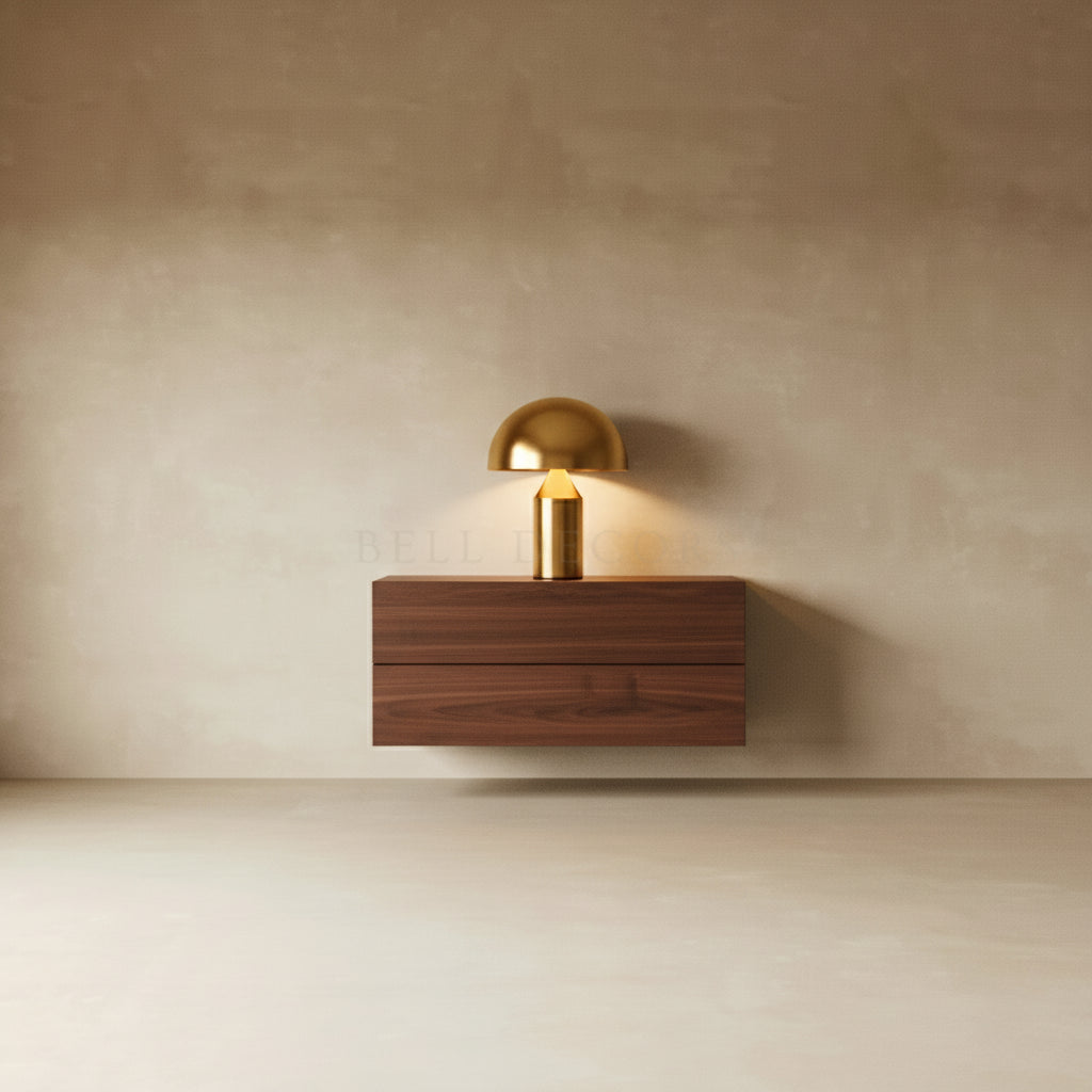 Wall-mounted lamp with wooden base and gold fixture on a beige wall.