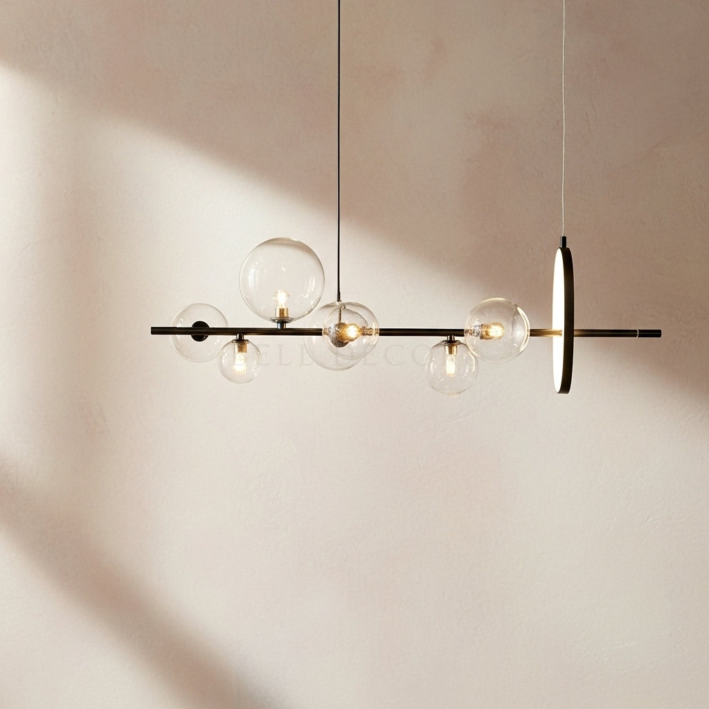 Modern pendant light with glass bulbs on a neutral background