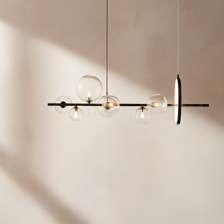 Modern pendant light with glass bulbs on a neutral background