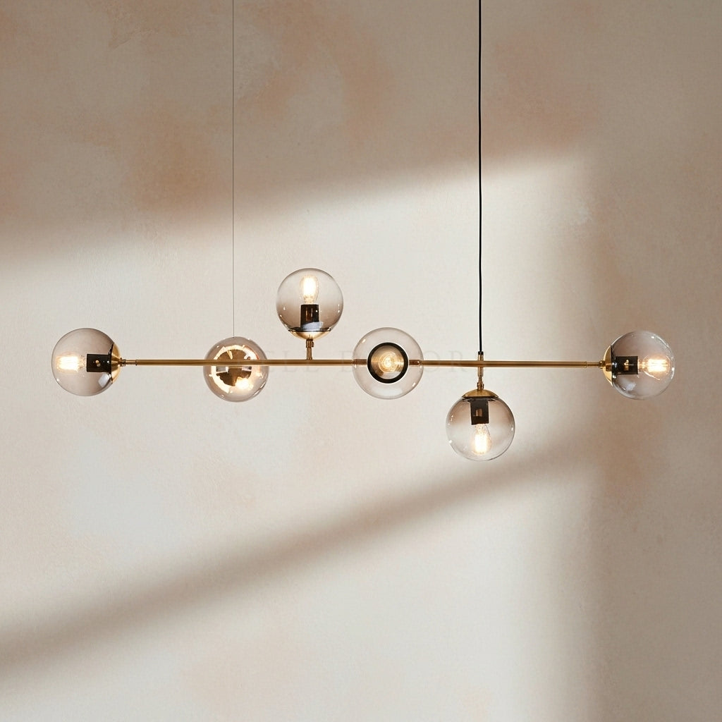 Modern chandelier with glass spheres on a neutral background