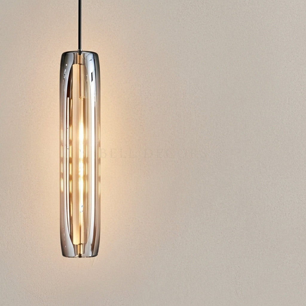 Modern pendant light with cylindrical glass shade on a neutral background