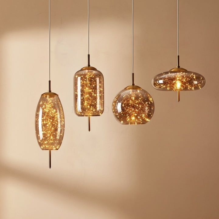 Set of four pendant lights with glass shades on a beige background