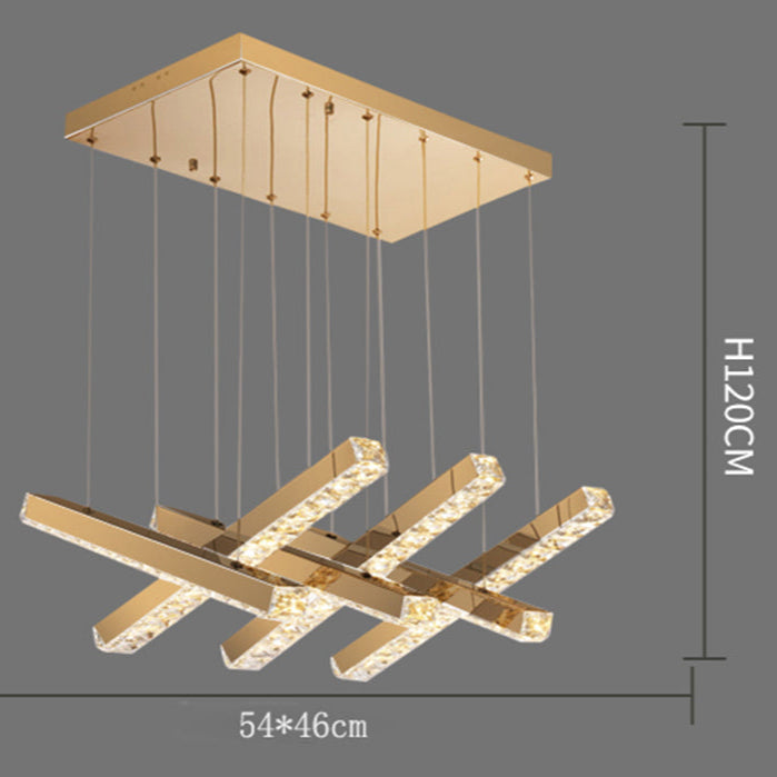 Gold pendant light fixture with dimensions on a gray background