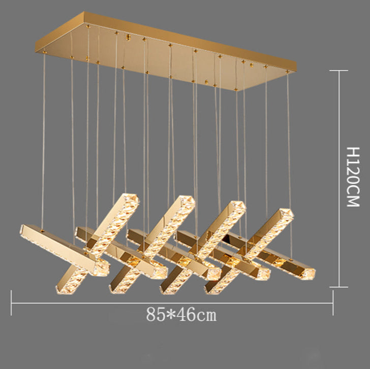 Gold pendant light fixture with dimensions on a gray background