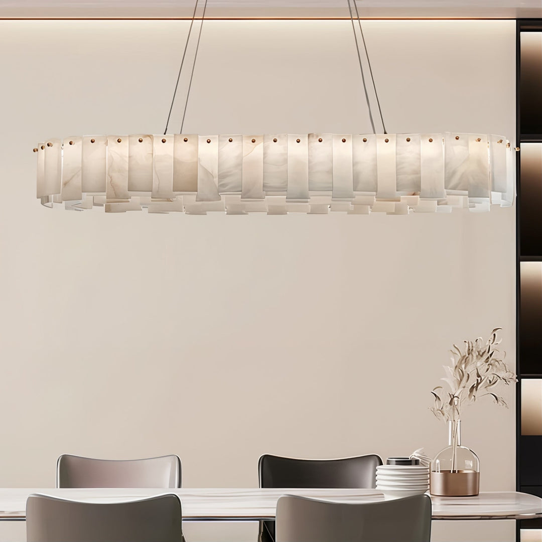 Linear Chandelier - LED Chandelier hanging above a dining table, featuring a contemporary design and elegant illumination.