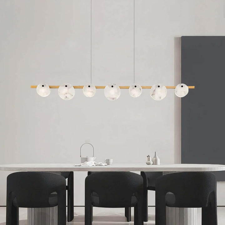 Foyer Chandelier - Linear Chandelier Dining Room illuminating a modern dining table with a stylish design.