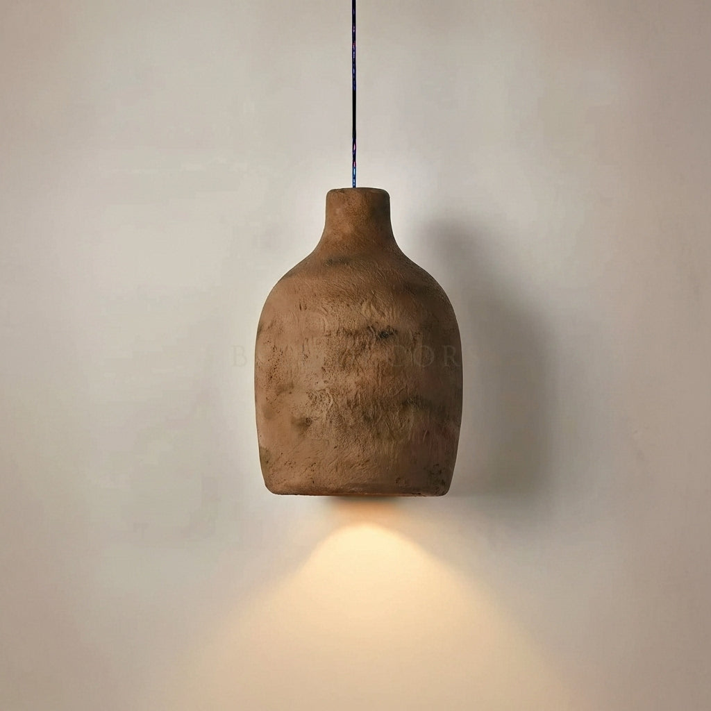 Ceramic pendant light hanging against a neutral wall