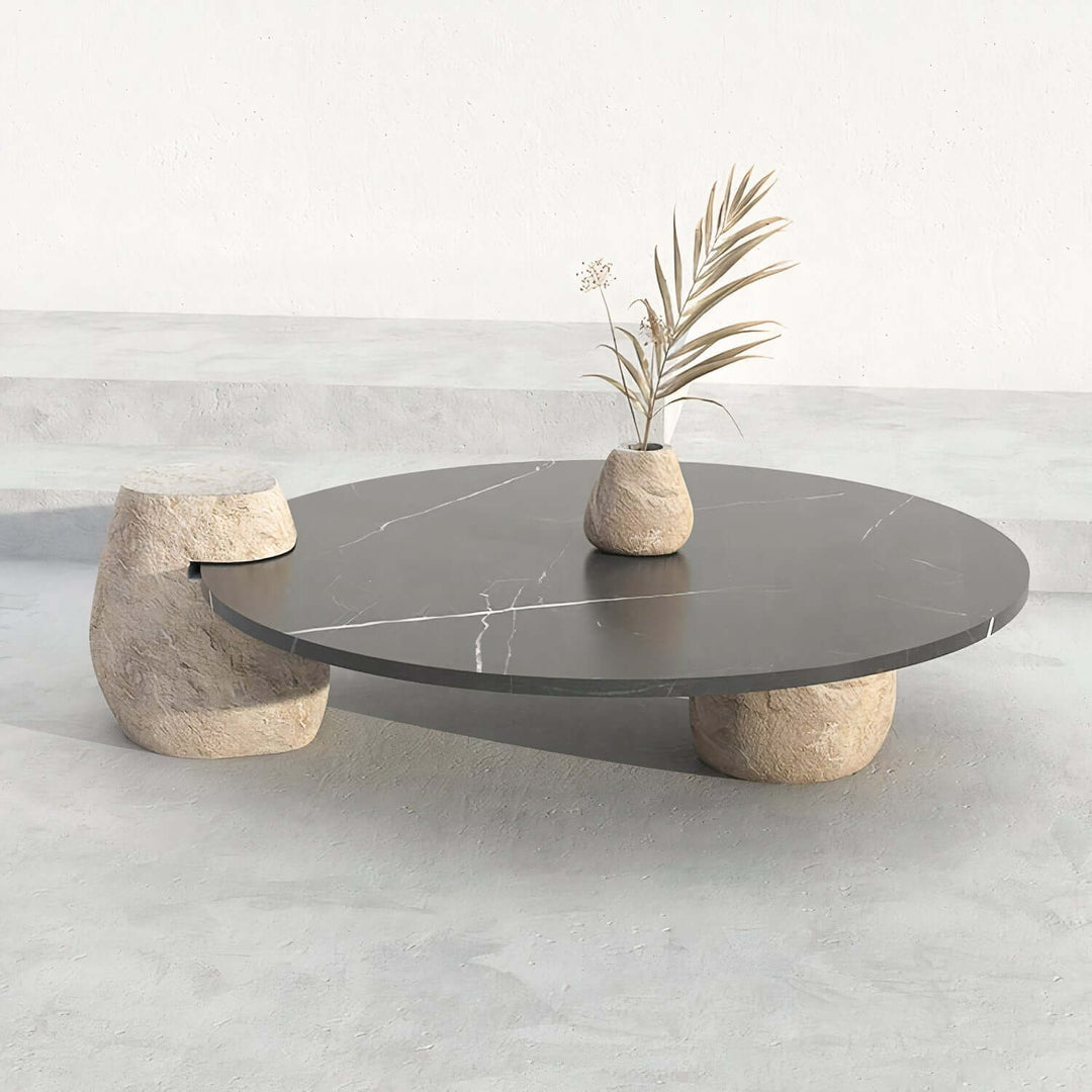 Black Coffee Table - Marble Coffee Table with unique stone legs and marble top in a minimalist setting.