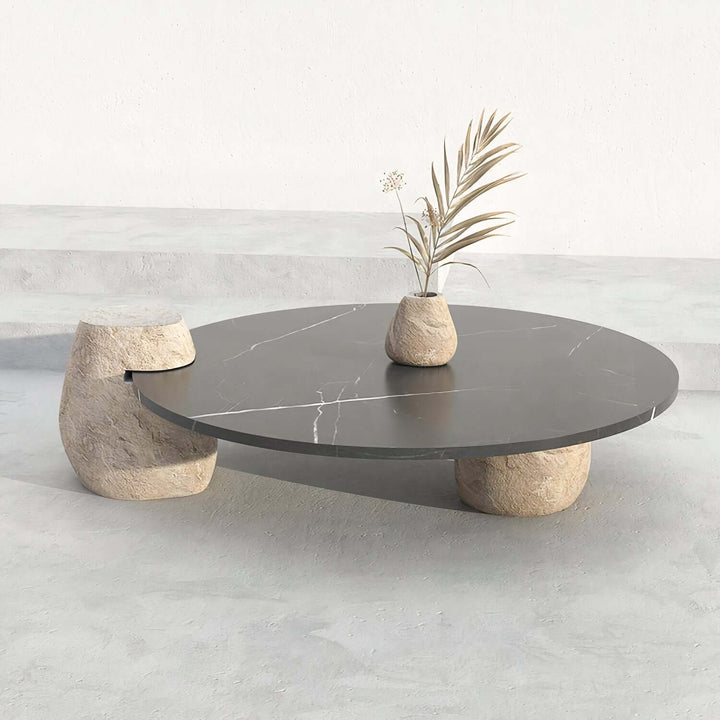 Black Coffee Table - Marble Coffee Table with unique stone legs and marble top in a minimalist setting.