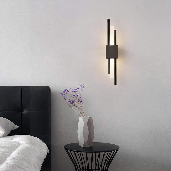 Gold Wall Light - Sleek Yet Contemporary illuminating a stylish bedroom with modern decor.