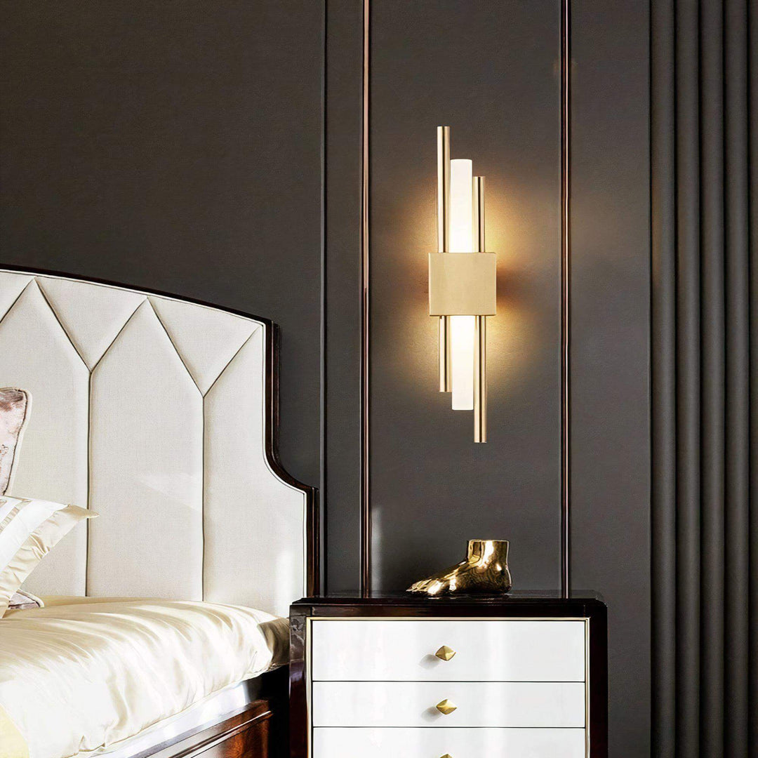 Gold Wall Light - Sleek Yet Contemporary illuminating a modern bedroom with elegant design.