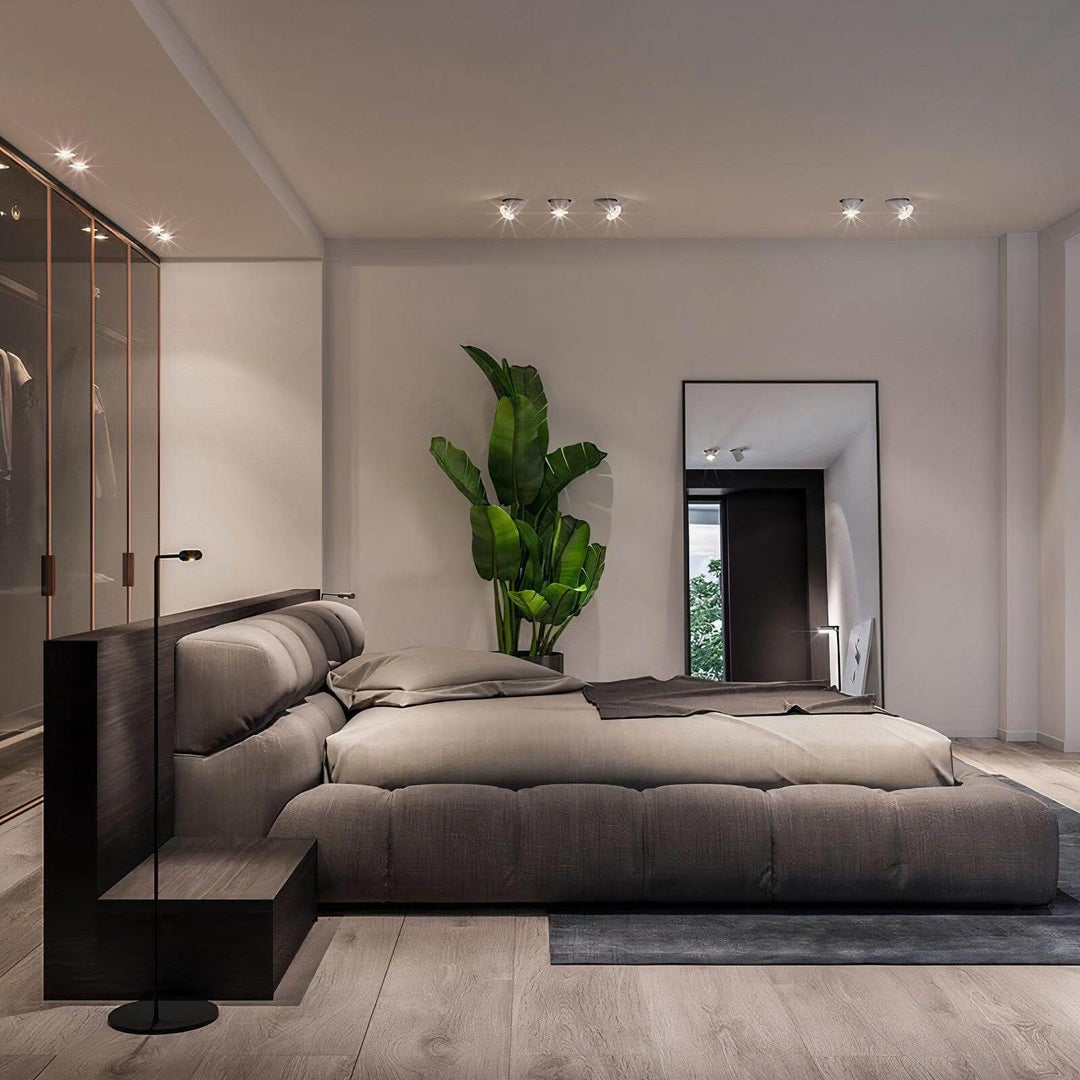 California King Bed - Modern & Luxurious in contemporary bedroom setting with stylish decor and plant.
