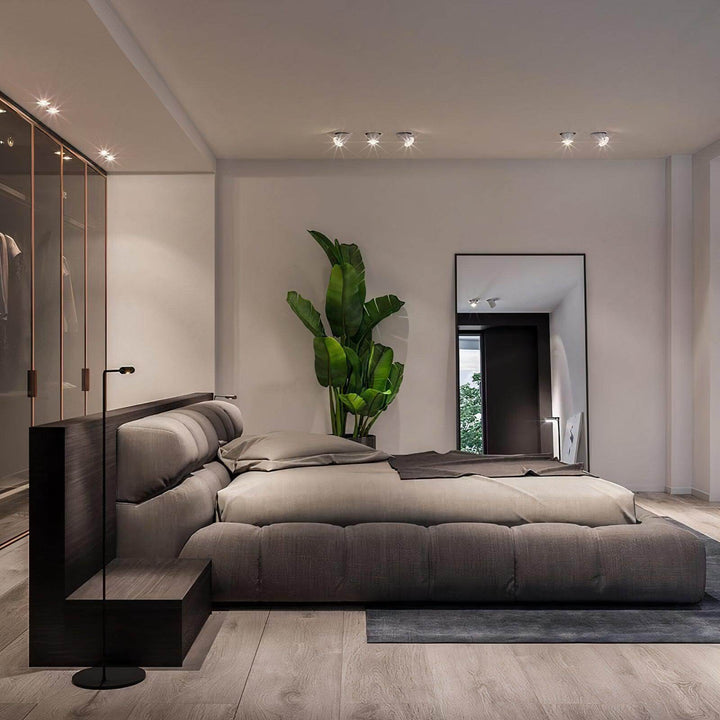California King Bed - Modern & Luxurious in contemporary bedroom setting with stylish decor and plant.