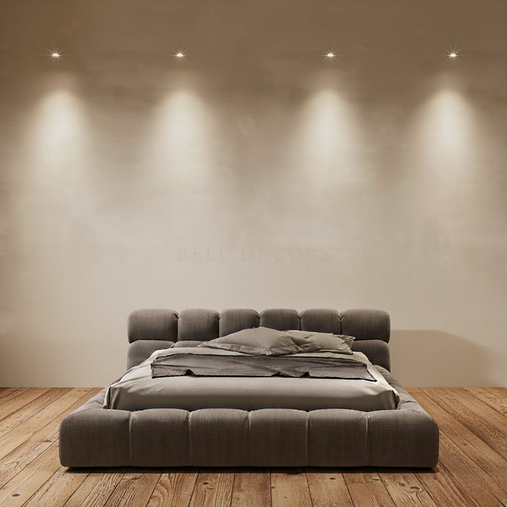 California King Bed - Modern & Luxurious with tufted linen in a grey tone on a solid wood base.