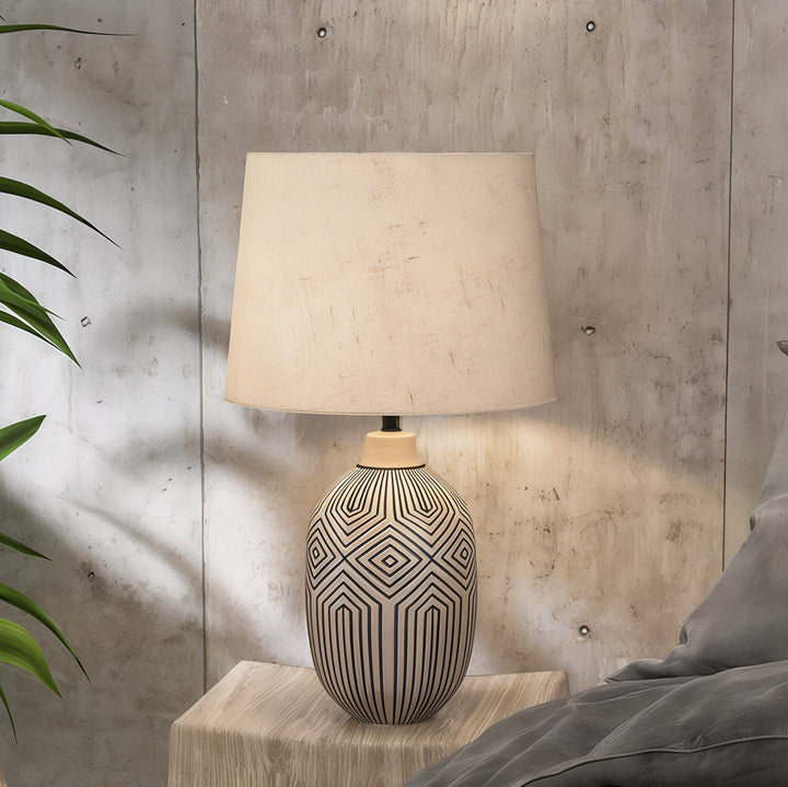 Mid Century Table Lamp - Artistic Centerpiece with ceramic base and fabric shade on nightstand in modern interior.