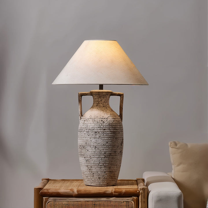 Mid Century Table Lamp - Imperfectly Perfect on a wooden side table, showcasing a ceramic base and subtle design.