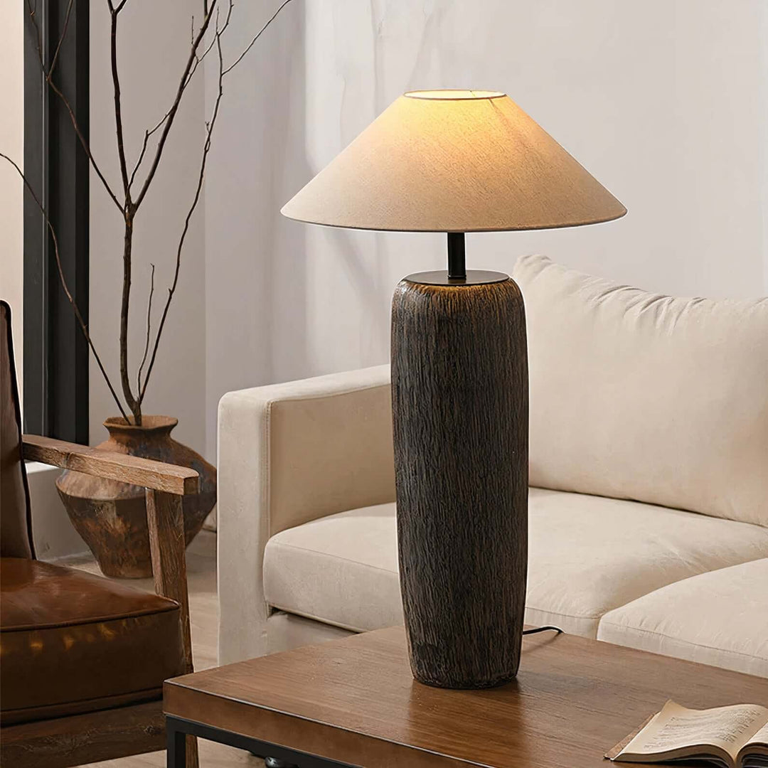 Black Table Lamp - Artistic Beauty illuminating a stylish living room, featuring ceramic base and fabric shade.