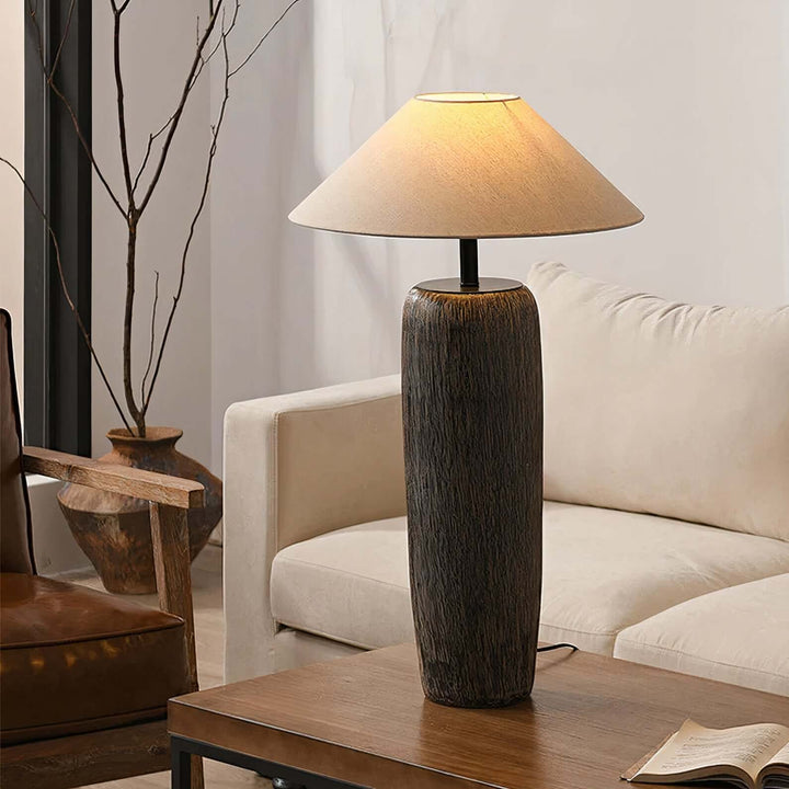 Black Table Lamp - Artistic Beauty illuminating a stylish living room, featuring ceramic base and fabric shade.
