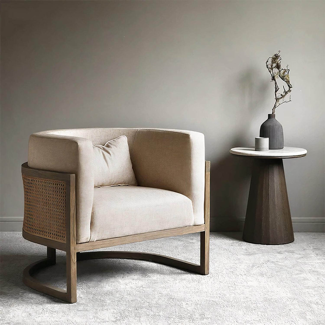 Lounge Chair - Comfortable Reading Chair in neutral linen upholstery with rattan details, perfect for cozy living rooms.