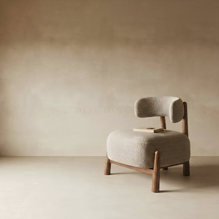 Comfortable Reading Armchair - Mid Century Armchair in a minimalistic living space with warm tones.