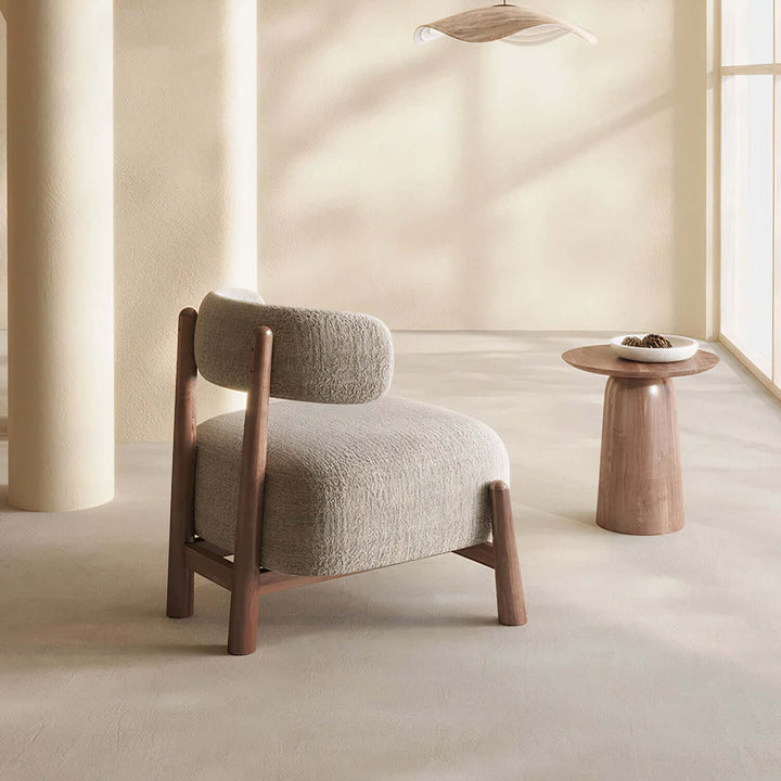 Comfortable Reading Armchair - Mid Century Armchair in a cozy, minimalist living space with natural tones.