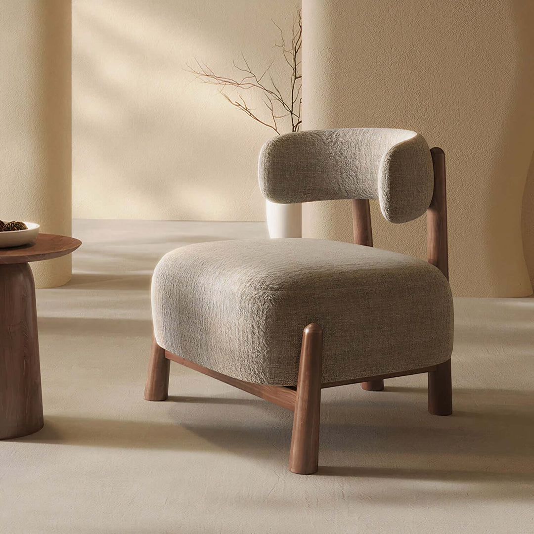 Comfortable Reading Armchair - Mid Century Armchair featuring a unique boucle design and wooden legs in a warm living space.