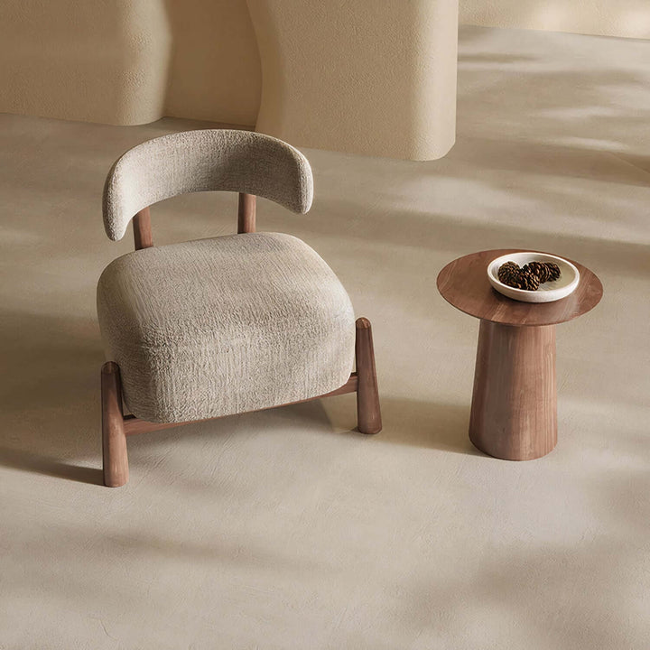 Comfortable Reading Armchair - Mid Century Armchair beside a modern side table in a minimalistic living space.