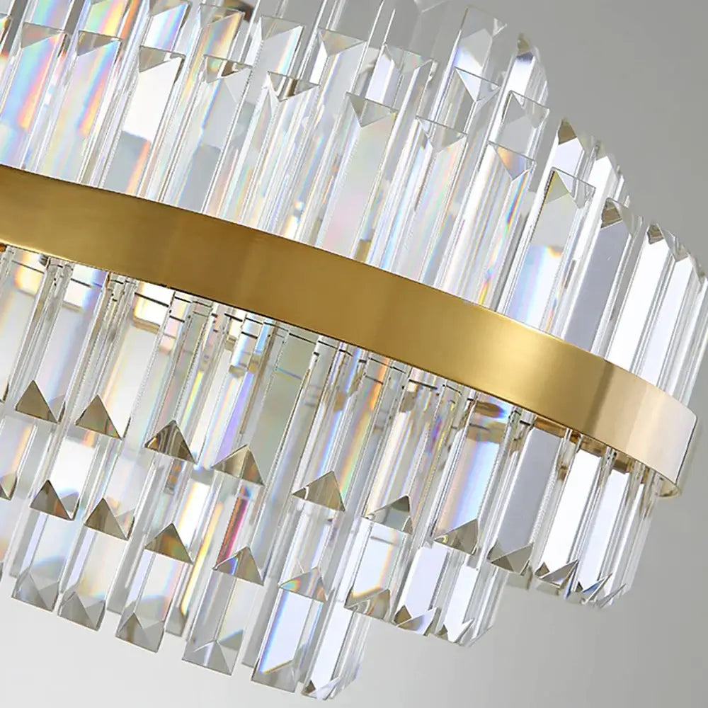 Elegant gold chandelier with crystal accents, reflecting light beautifully to enhance any room's decor.