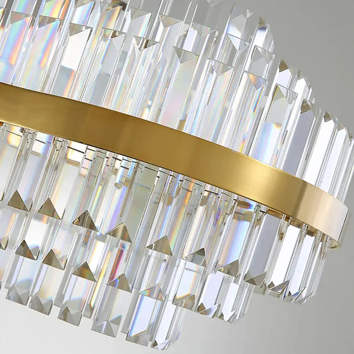 Elegant gold chandelier with crystal accents, reflecting light beautifully to enhance any room's decor.