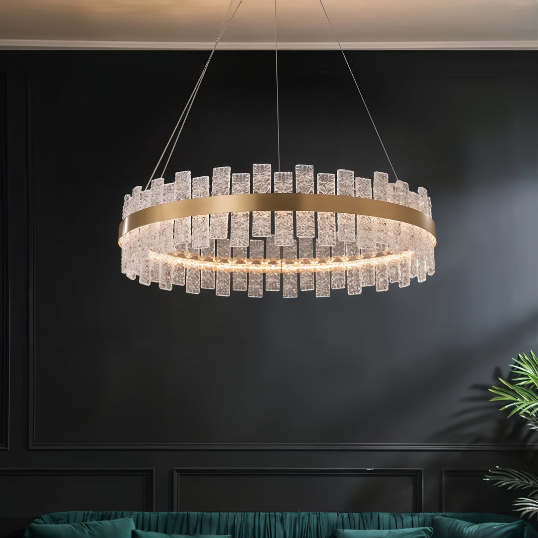 Gold Chandelier - Linear Chandelier with glass elements illuminating a modern living space.