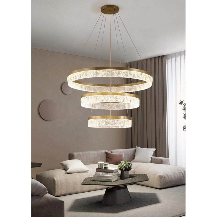 Staircase Chandelier - Foyer Chandelier hanging in a modern living room with elegant decor and bright lighting.
