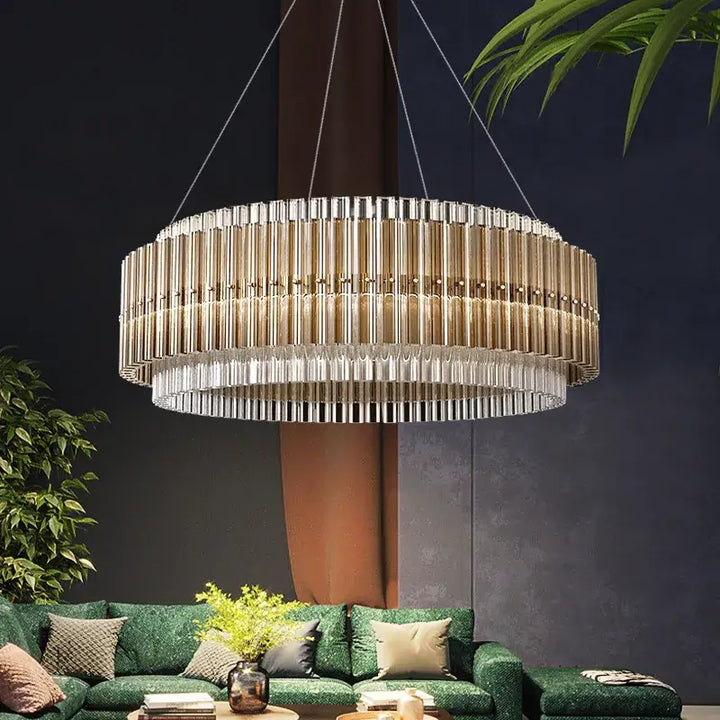 Gold chandelier with crystal accents, adding elegance and sophistication to a modern living room setting.